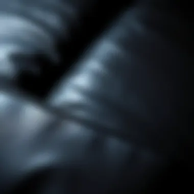 Textured close-up of a black leather sectional showcasing quality craftsmanship
