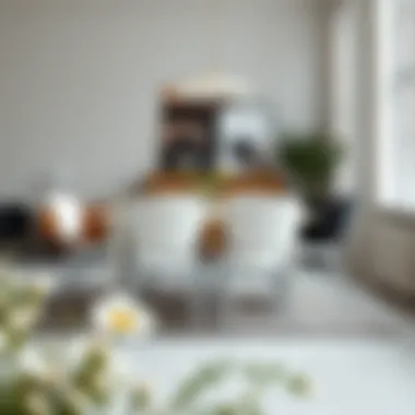 Modern Dining Environment with Stylish White Chairs Stylish white dining chairs in a modern dining environment