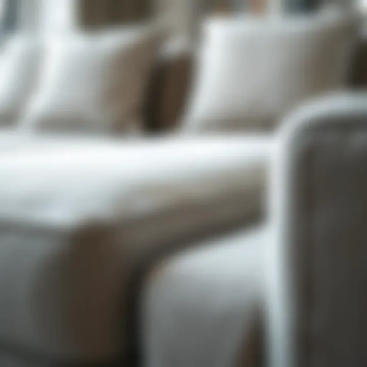 Close-up of the texture and fabric of a light grey sectional sofa